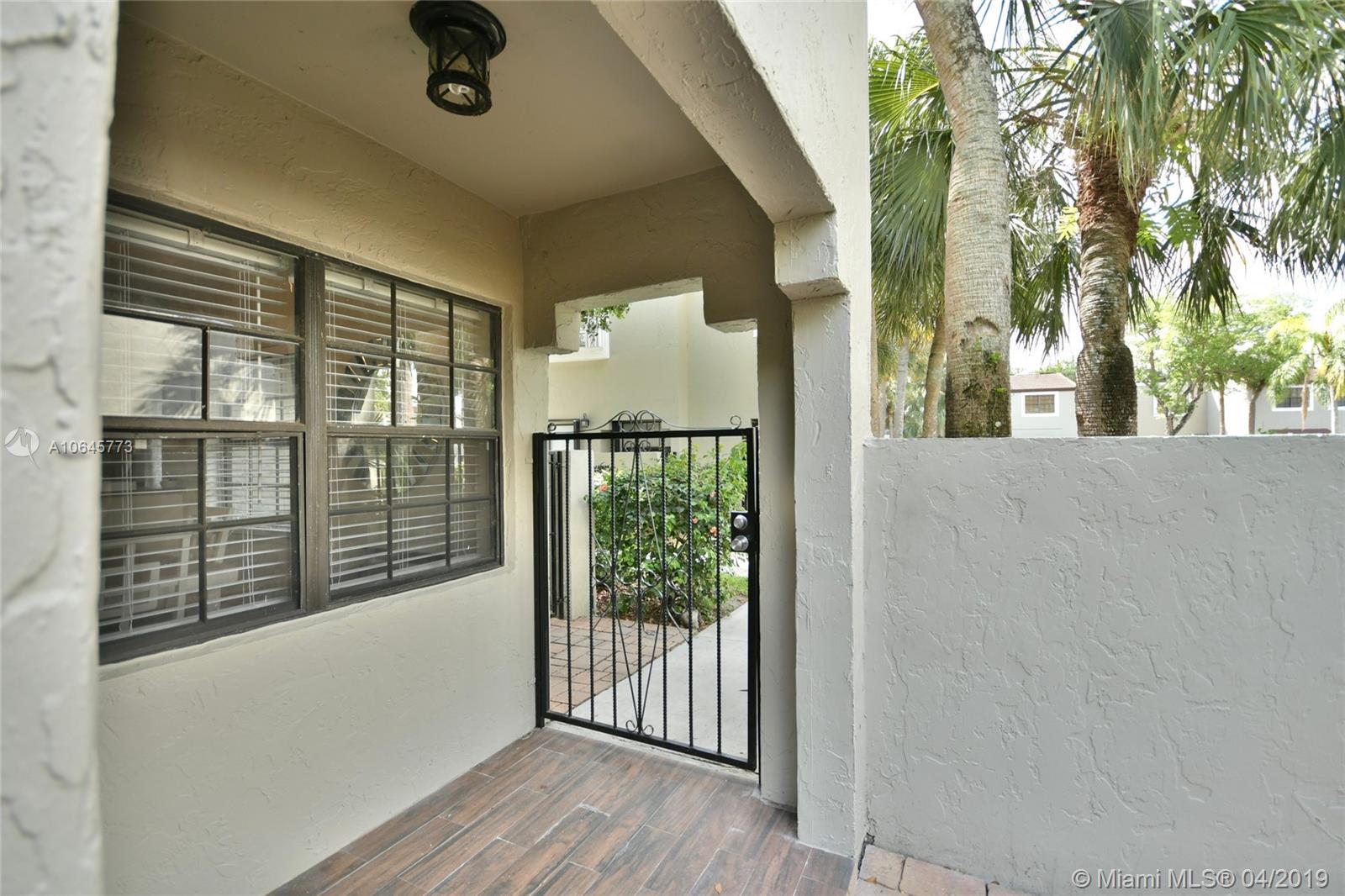 10475 Southwest 153rd Court, Unit 8 Miami, FL 33196 - Photo 6 of 65 Courtyard Entry