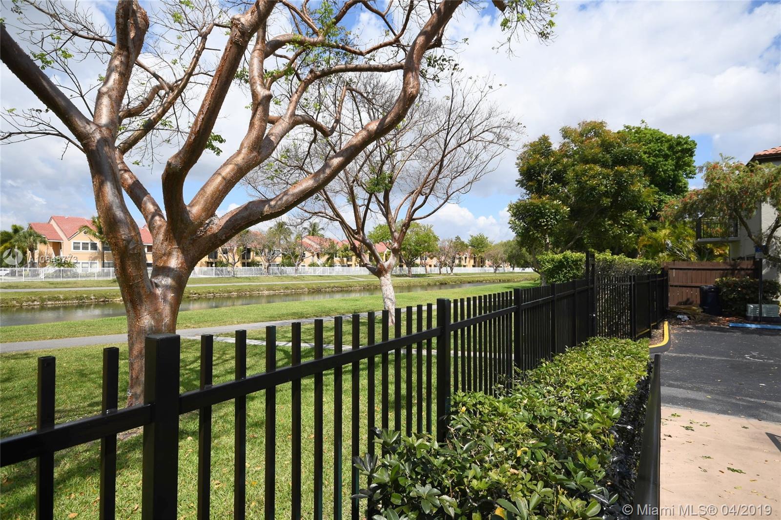 10475 Southwest 153rd Court, Unit 8 Miami, FL 33196 - Photo 60 of 65 Park & Lake view from Community Pool