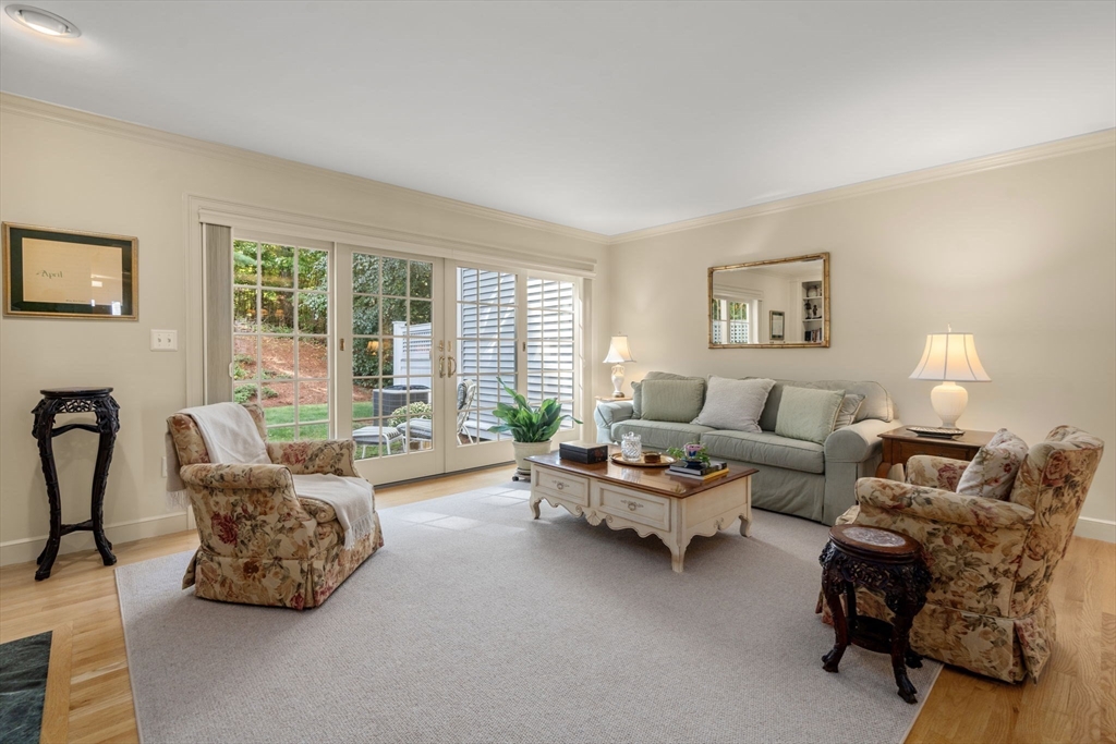 9 Highcroft Way, Unit 9 Hopkinton, MA 01748 - Photo 12 of 22 a living room with furniture and a large window