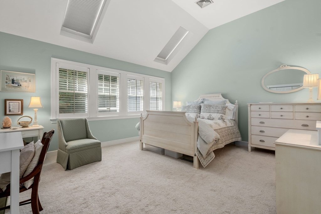 9 Highcroft Way, Unit 9 Hopkinton, MA 01748 - Photo 14 of 22 a bedroom with furniture and a window