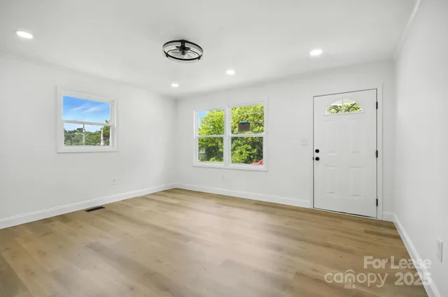 a view of an empty room with a window