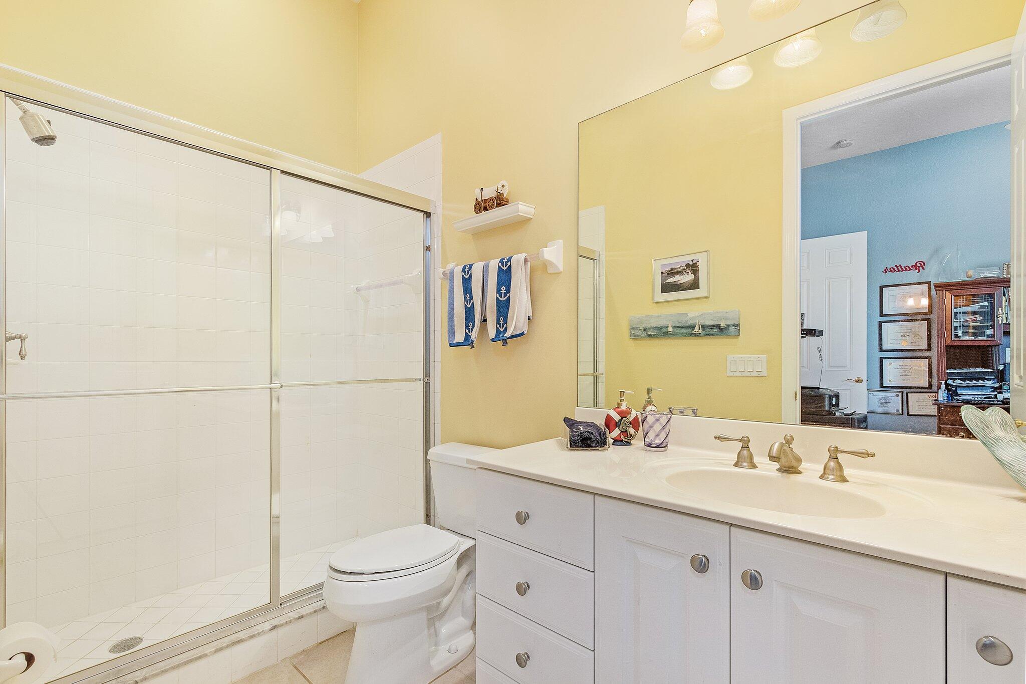 9283 Museo Circle, Unit 204 Naples, FL 34114 - Photo 15 of 23 a bathroom with a sink toilet and shower