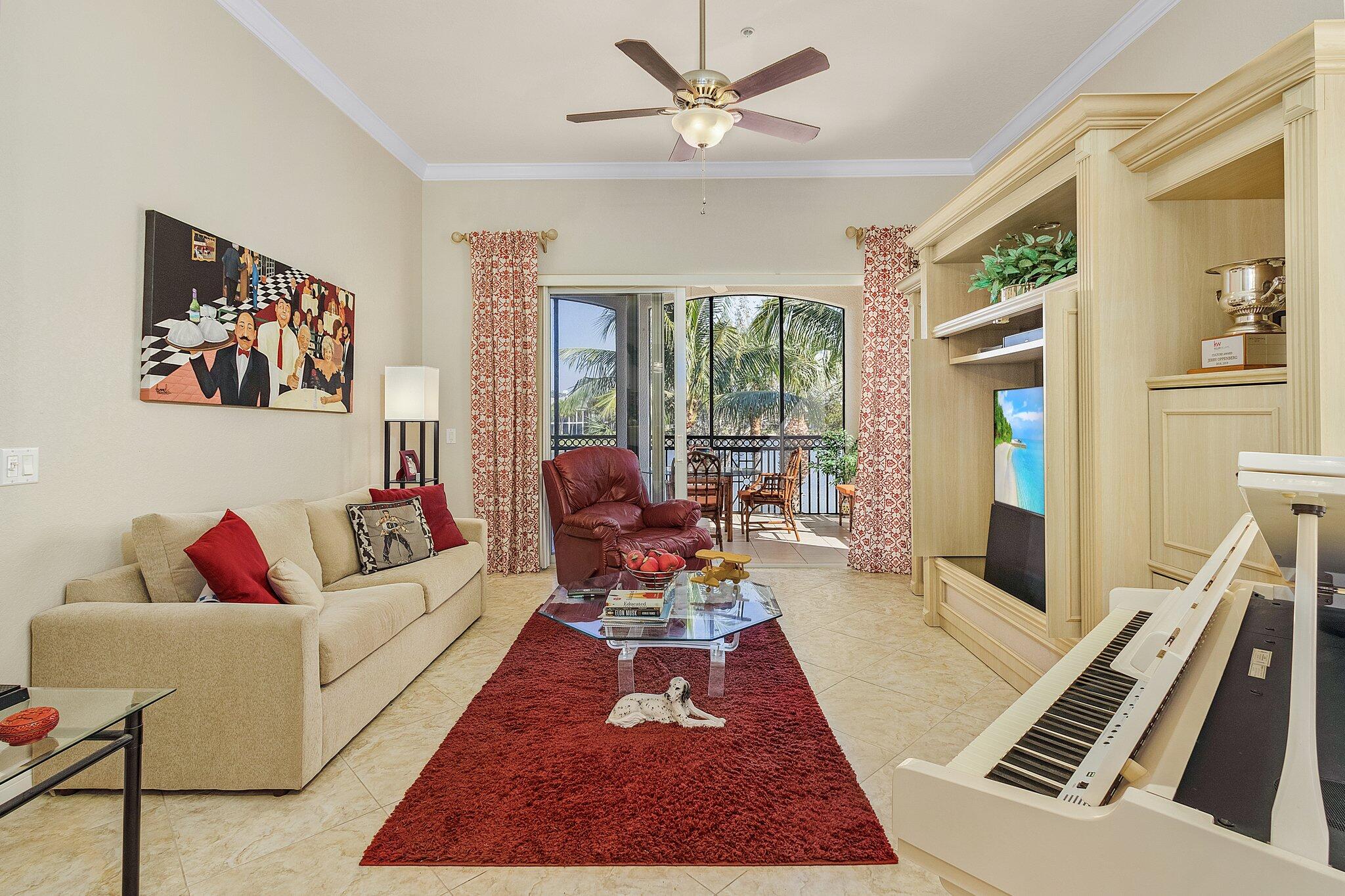 9283 Museo Circle, Unit 204 Naples, FL 34114 - Photo 7 of 23 a living room with furniture rug and window