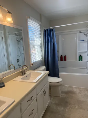 a bathroom with a sink a toilet and a bathtub