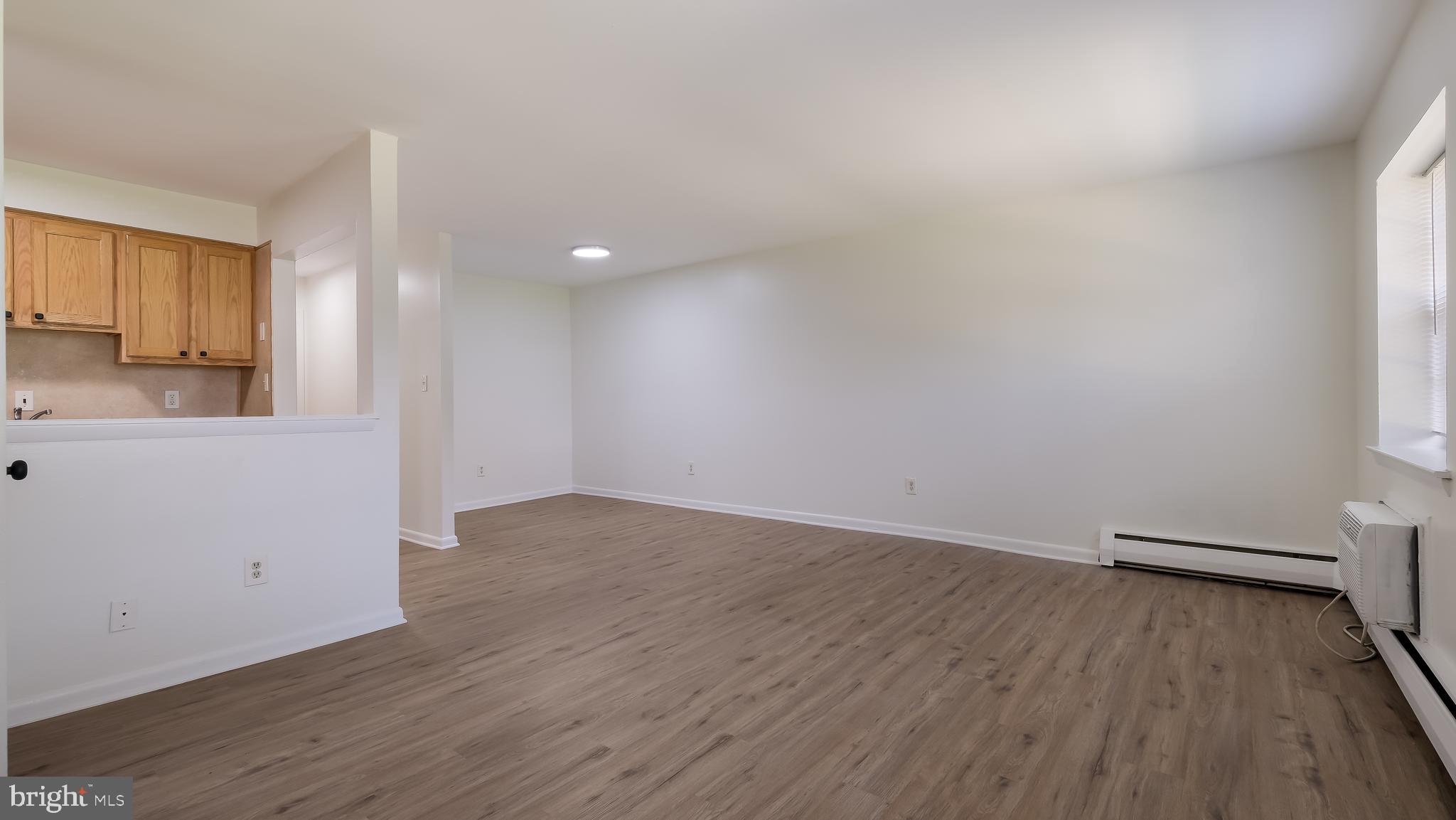 4701 Pennell Road Aston, PA 19014 - Photo 11 of 24 an empty room with wooden floor and windows