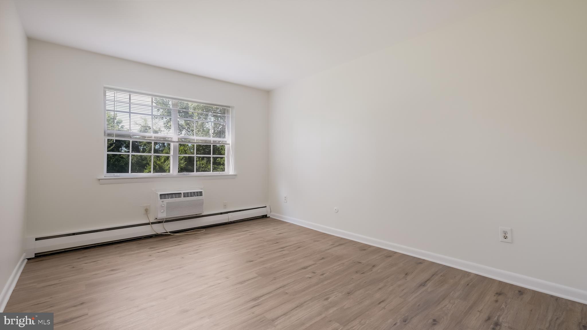 4701 Pennell Road Aston, PA 19014 - Photo 13 of 24 an empty room with wooden floor and windows