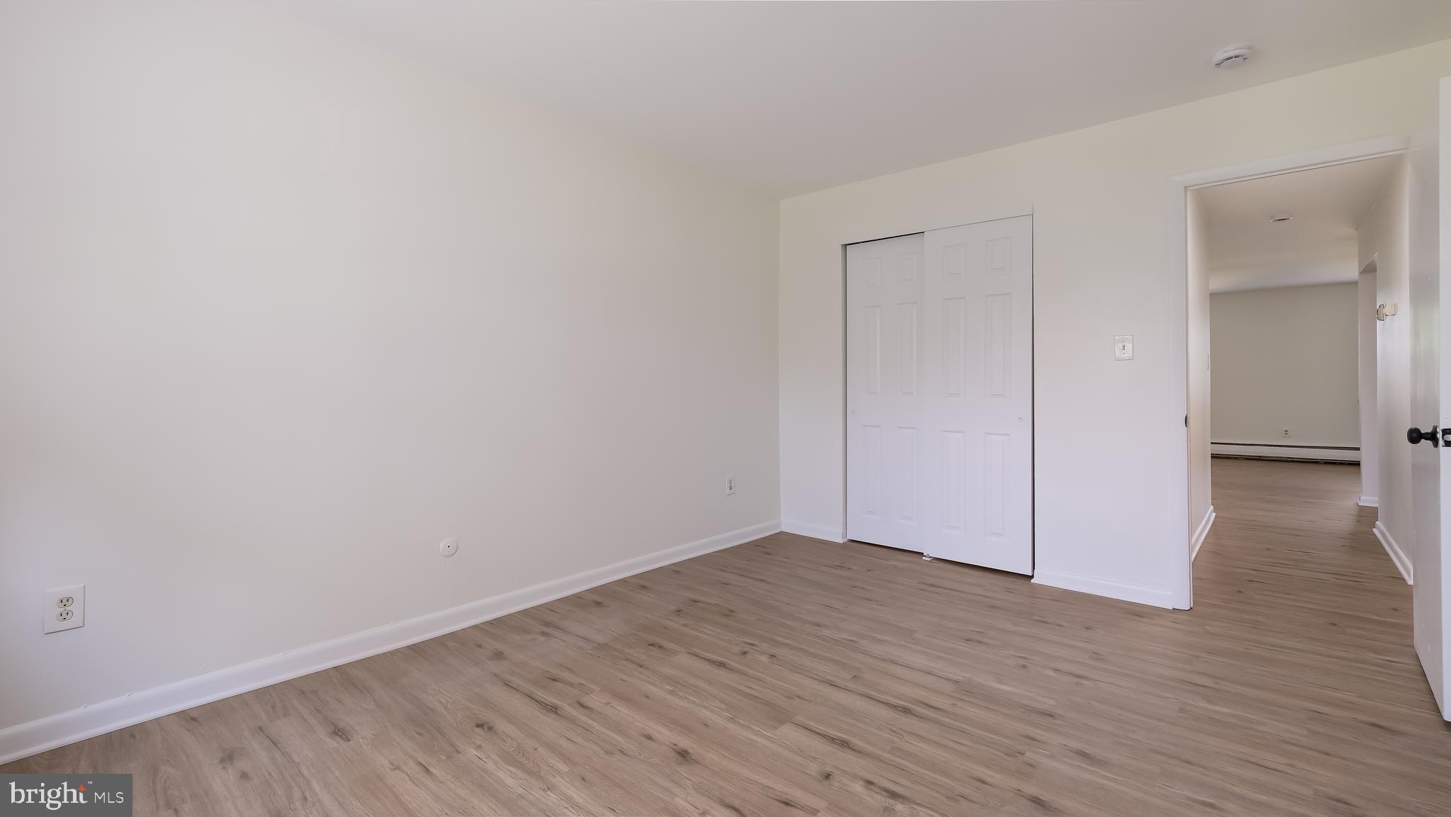 4701 Pennell Road Aston, PA 19014 - Photo 14 of 24 a view of an empty room with wooden floor