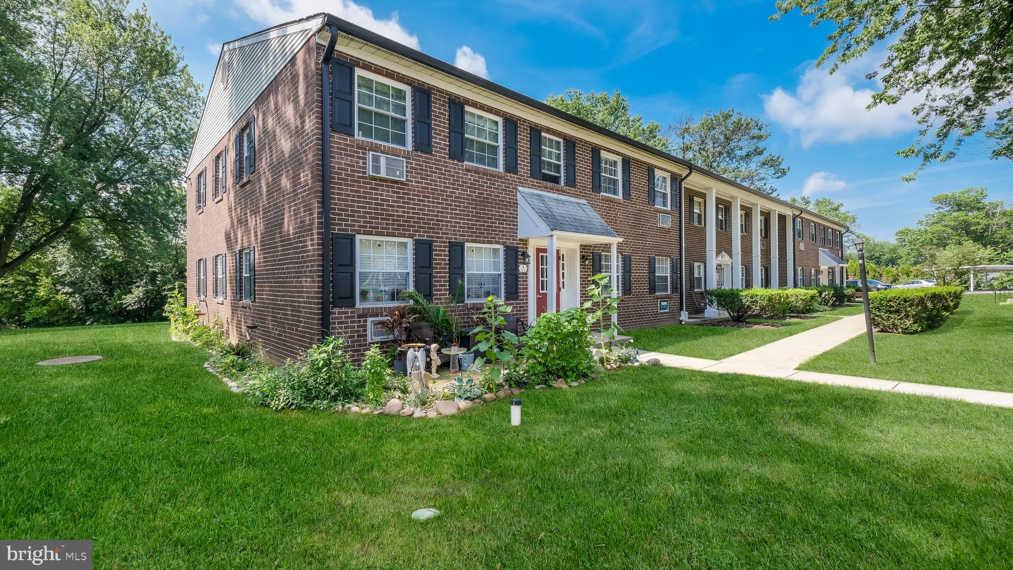 4701 Pennell Road Aston, PA 19014 - Photo 21 of 24 a view of a house with a yard and plants
