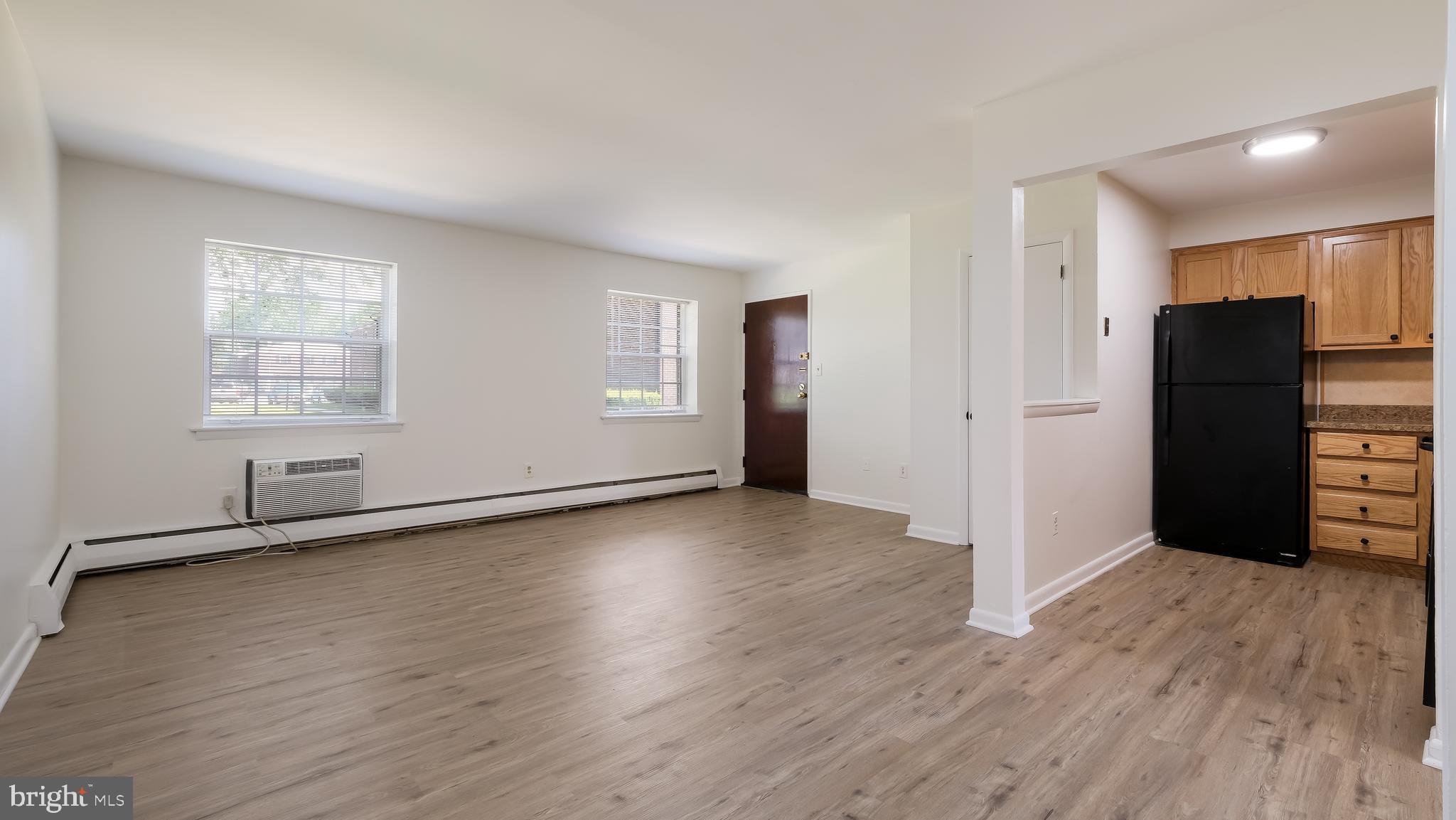 4701 Pennell Road Aston, PA 19014 - Photo 3 of 24 an empty room with wooden floor and windows