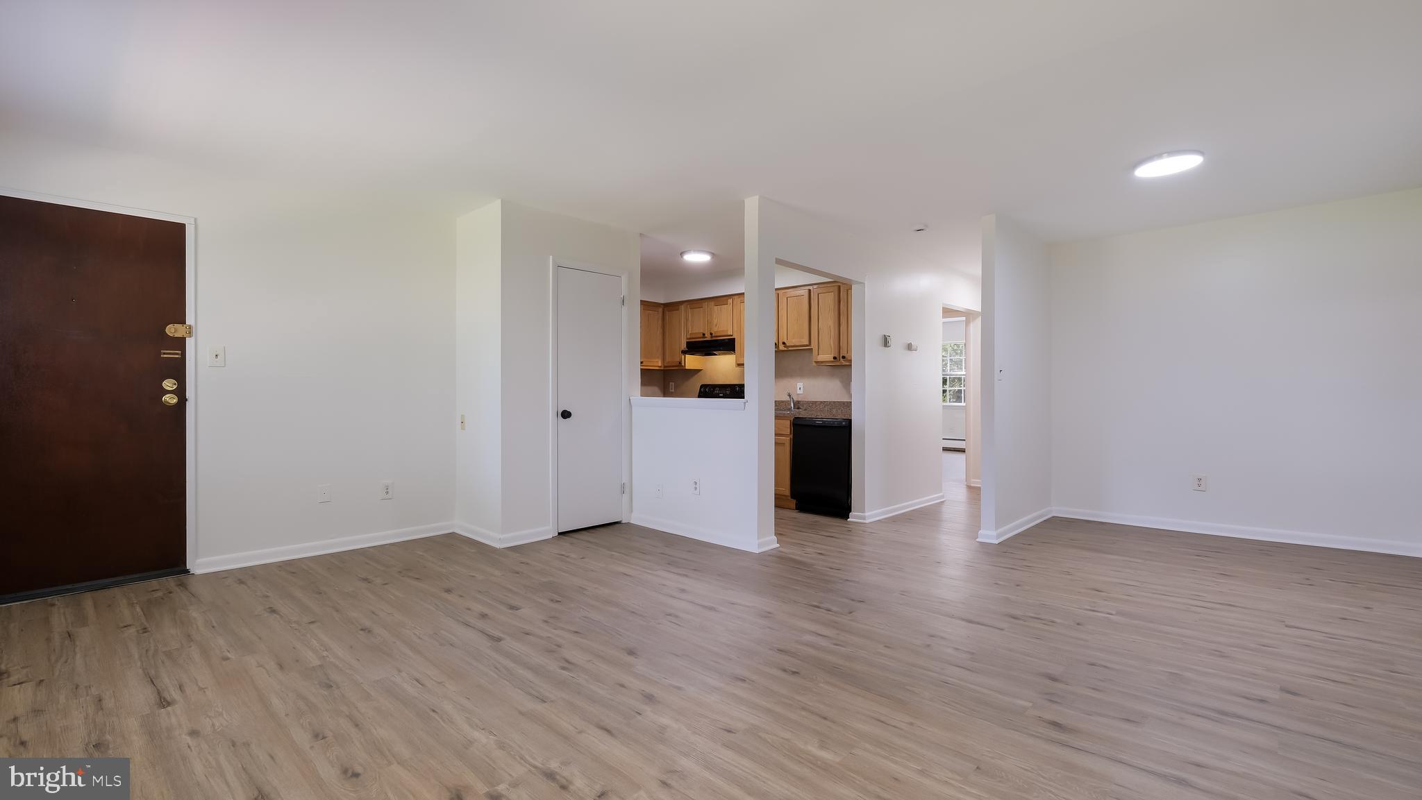 4701 Pennell Road Aston, PA 19014 - Photo 5 of 24 an empty room with wooden floor and an entrance