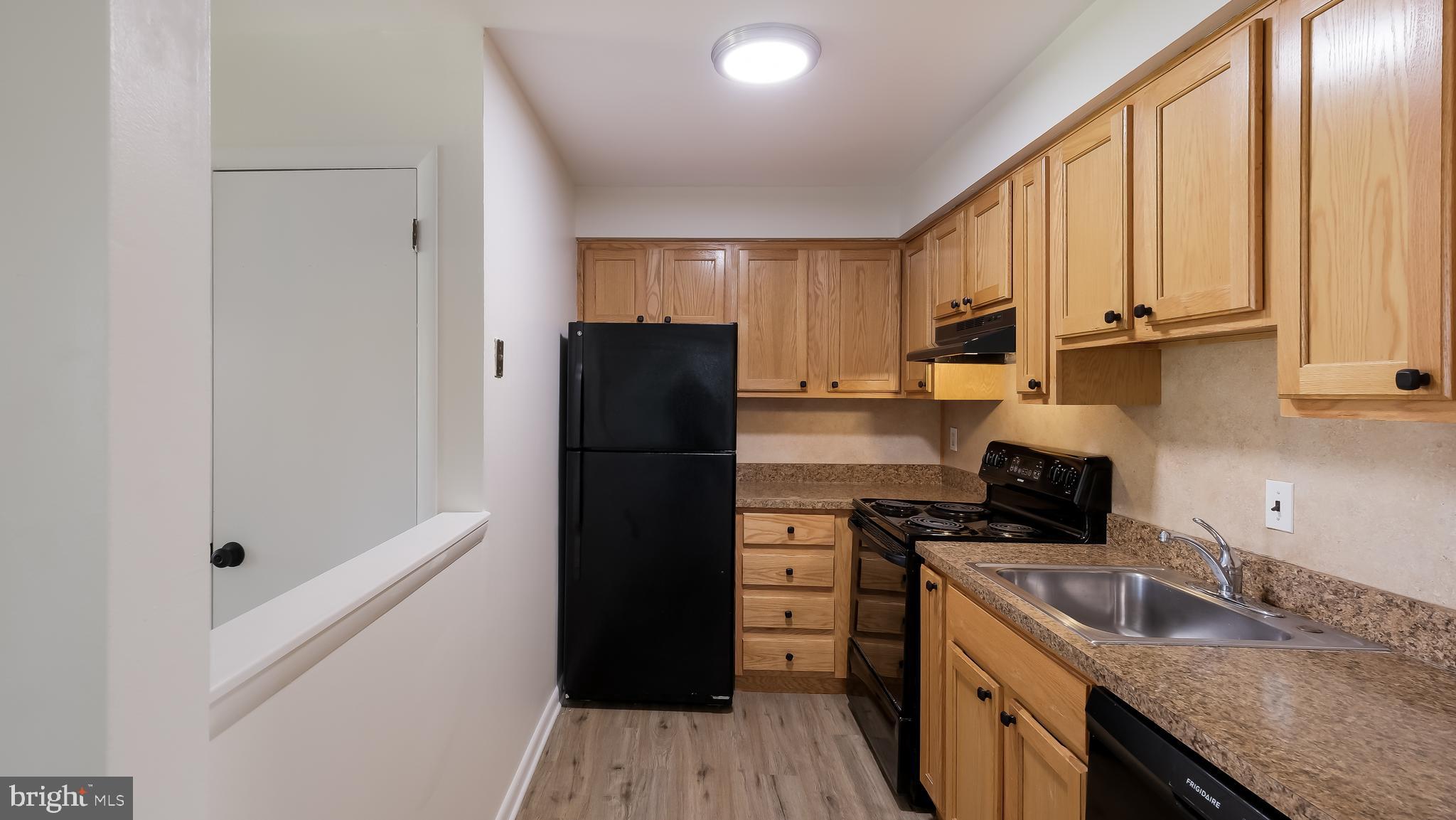 4701 Pennell Road Aston, PA 19014 - Photo 6 of 24 a kitchen with stainless steel appliances granite countertop a refrigerator and a sink