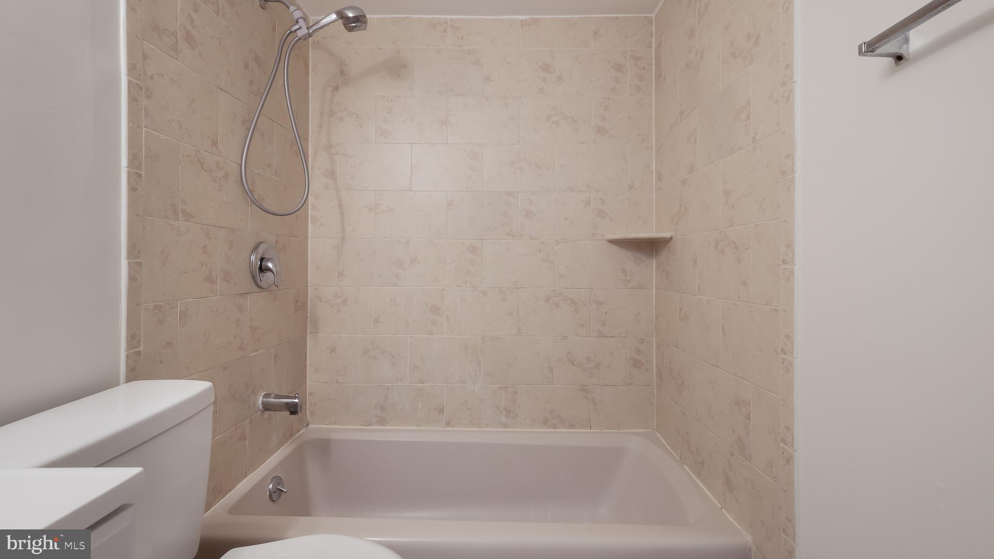 4701 Pennell Road Aston, PA 19014 - Photo 9 of 24 a bathroom with a bathtub and toilet