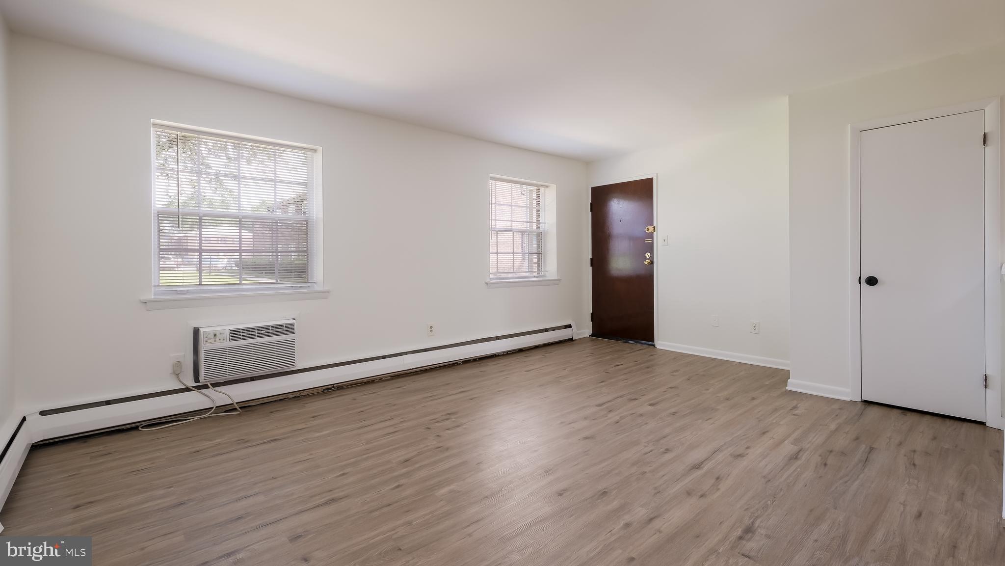 4701 Pennell Road Aston, PA 19014 - Photo 10 of 24 an empty room with wooden floor and windows