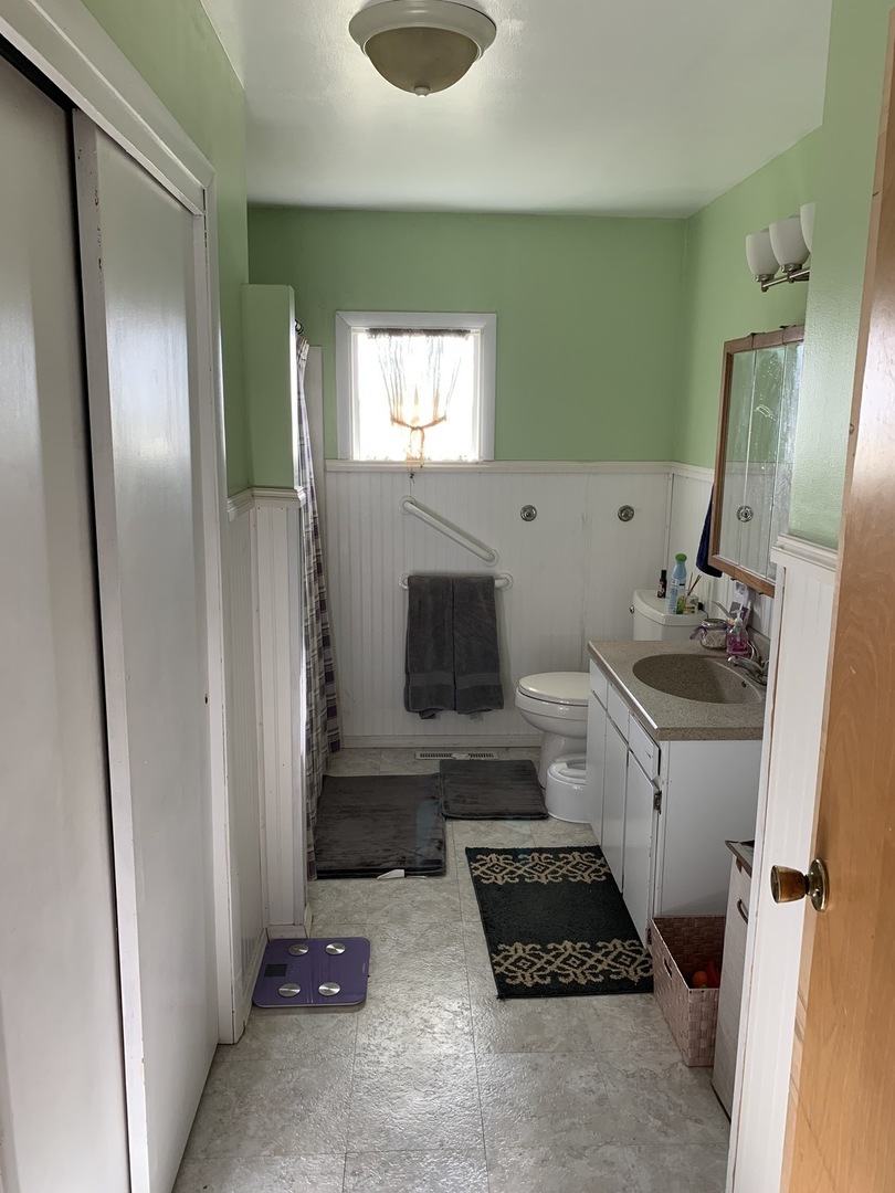 11624 Highway 17 Bonfield, IL 60913 - Photo 9 of 14 a bathroom with a sink and a mirror