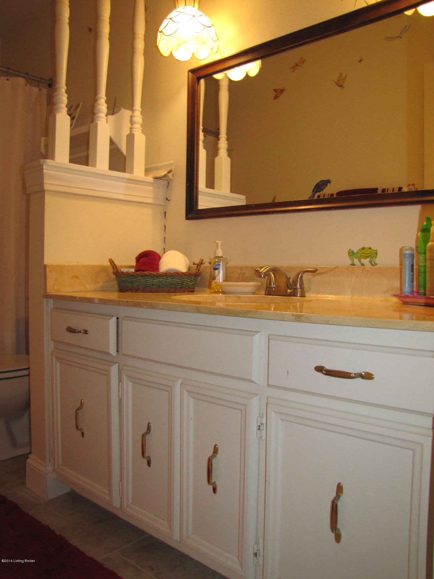 10710 Sun Ridge Road Goshen, KY 40026 - Photo 38 of 55 The Full Hall Bath offers tiled flooring, ample counter space, white cabinetry, custom mirror, quaint double lighting pendants, plus a shower/tub combo