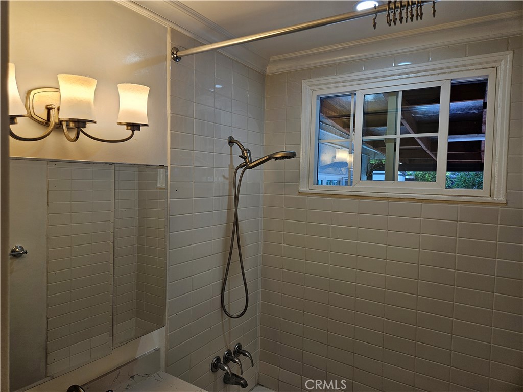 8030 Lemona Avenue Panorama City, CA 91402 - Photo 17 of 29 a bathroom with a shower and a mirror
