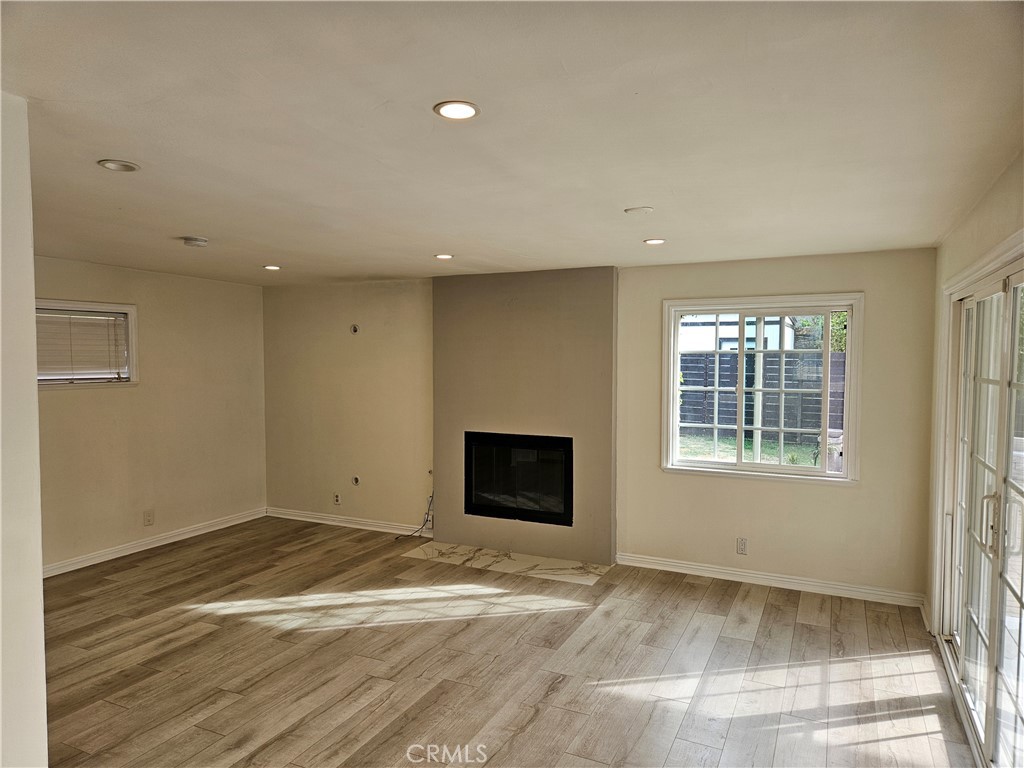 8030 Lemona Avenue Panorama City, CA 91402 - Photo 28 of 29 a view of empty room with wooden floor and fan