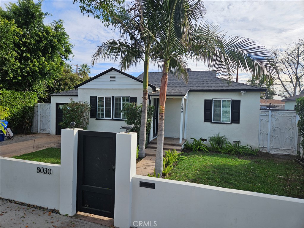 8030 Lemona Avenue Panorama City, CA 91402 - Photo 29 of 29 front view of house with a yard and palm trees