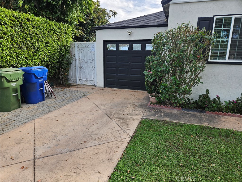 8030 Lemona Avenue Panorama City, CA 91402 - Photo 4 of 29 a view of a pathway in back yard of the house
