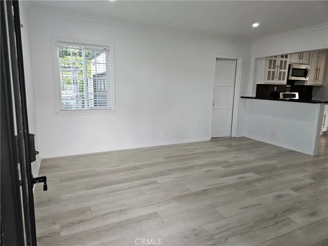 a view of a kitchen with a sink cabinets and a window