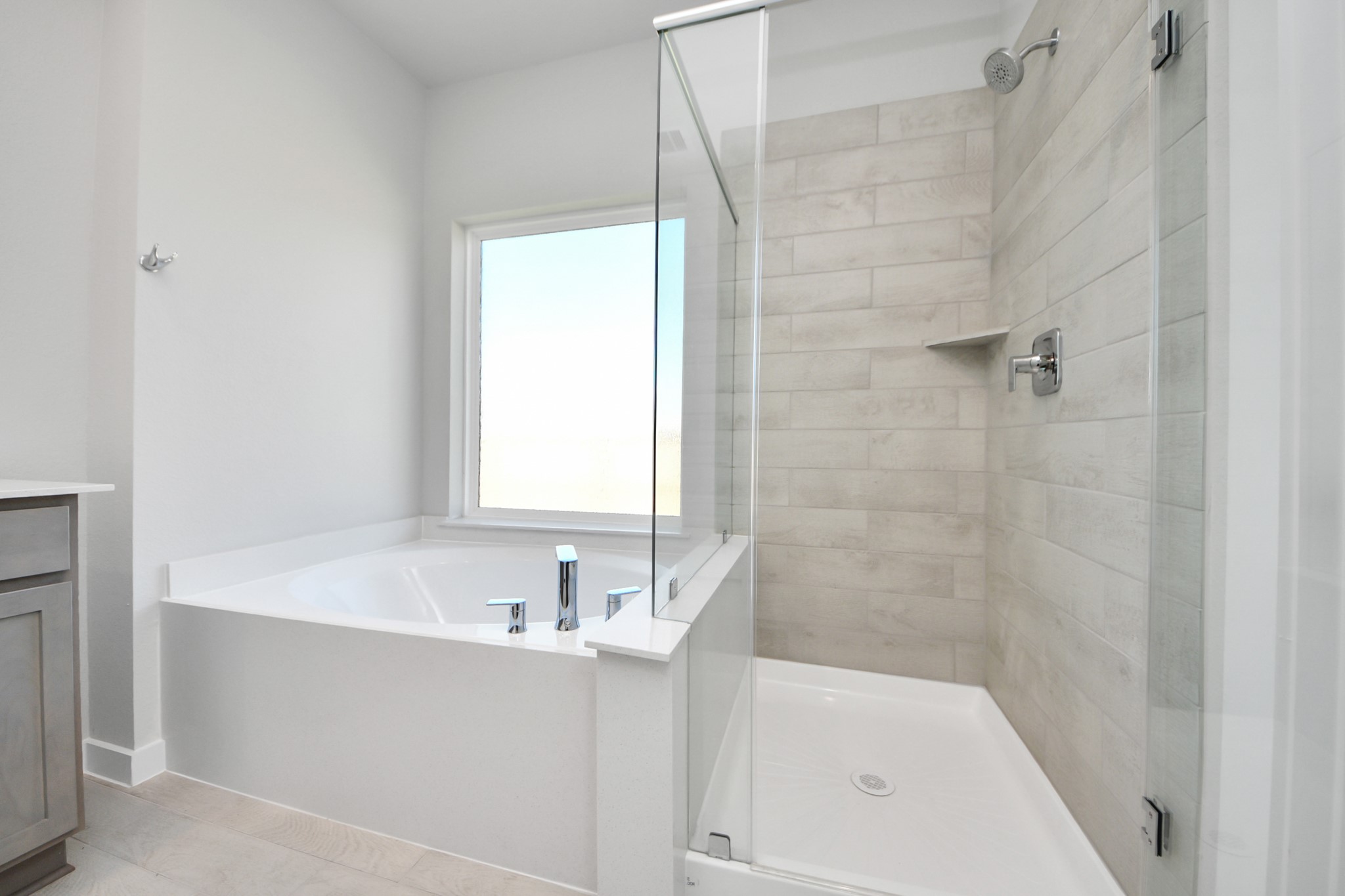 15807 Telge Ridge Lane Cypress, TX 77429 - Photo 26 of 45 a bathroom with a bathtub and shower