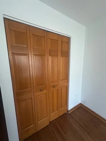a bathroom with a sink mirror vanity and toilet