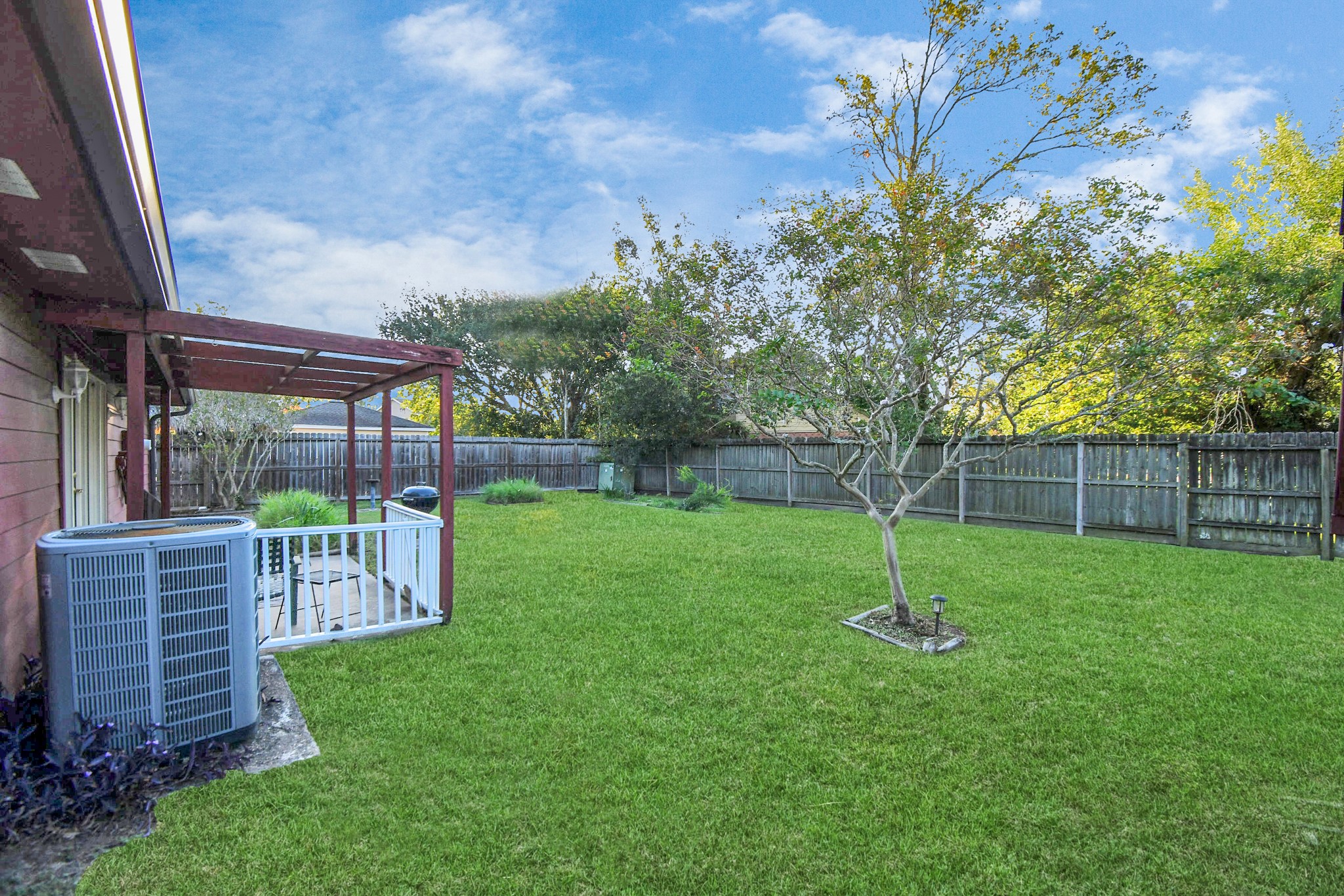 403 Westwood Drive Friendswood, TX 77546 - Photo 37 of 38 a view of a backyard with a garden
