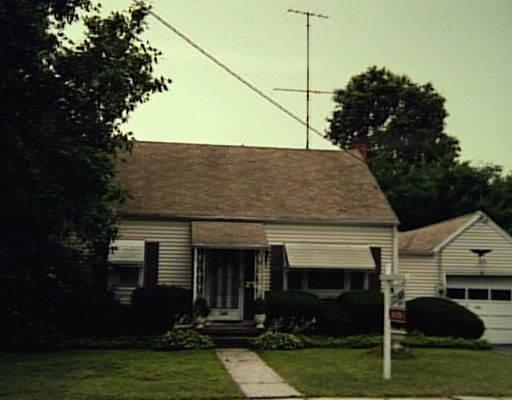 a view of house with yard