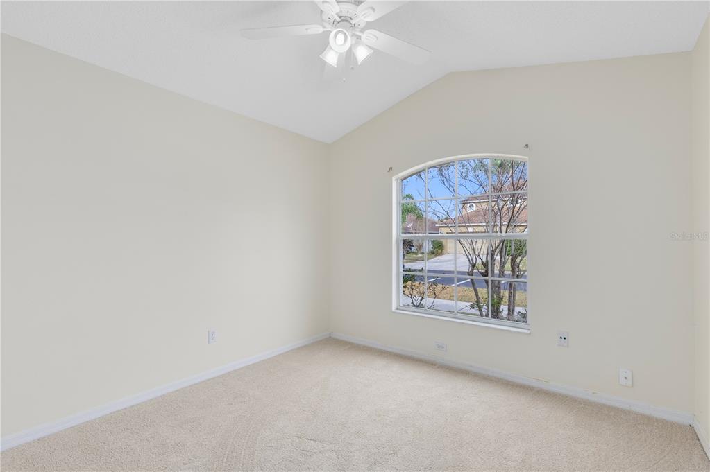 3640 Sickle Street Orlando, FL 32812 - Photo 14 of 21 an empty room with windows and fan