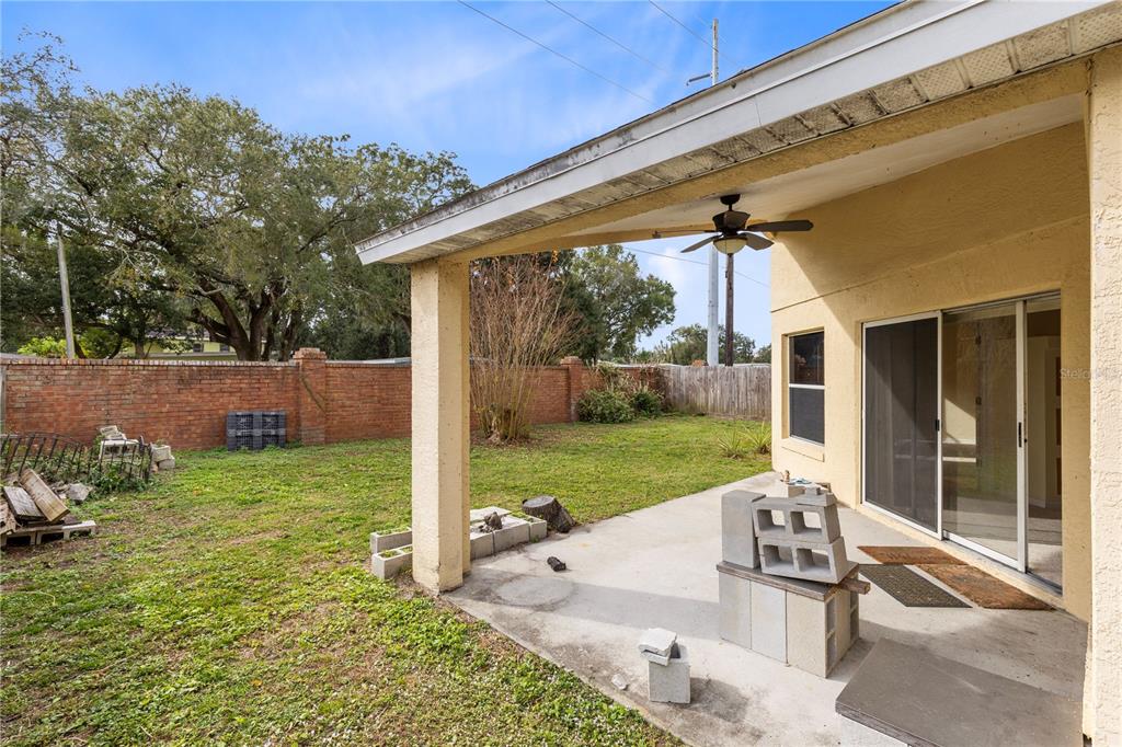 3640 Sickle Street Orlando, FL 32812 - Photo 18 of 21 a view of a house with backyard and sitting area