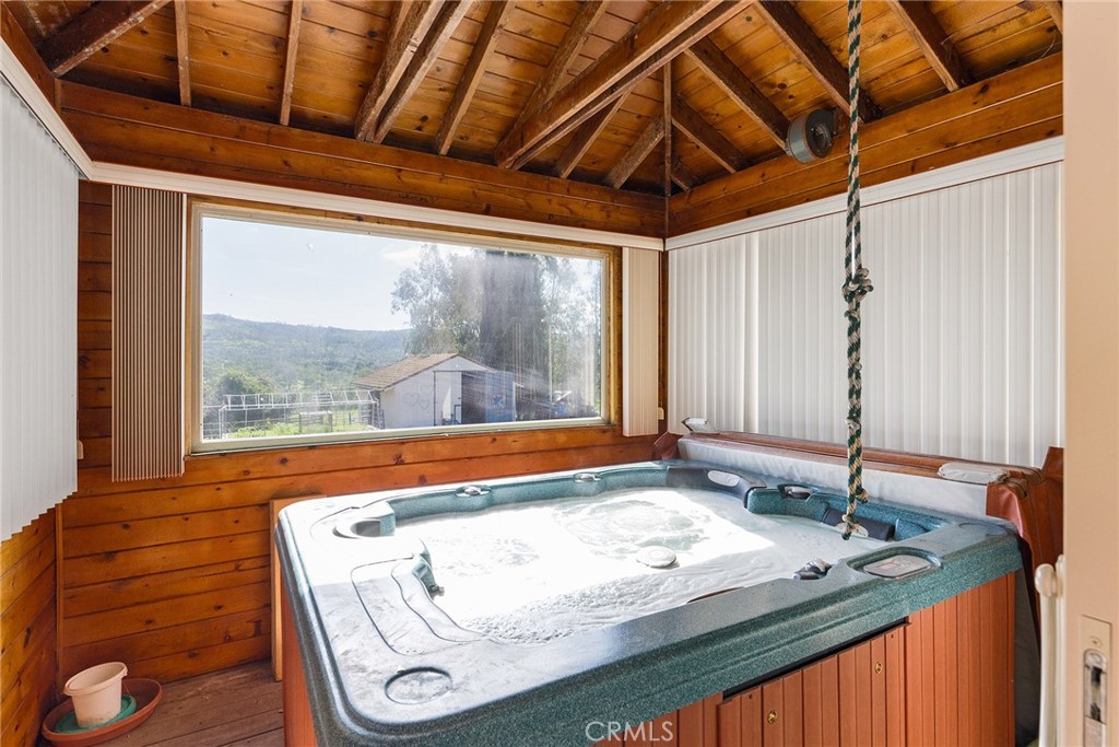 32 Mission Olive Road Oroville, CA 95966 - Photo 30 of 52 a bathroom with a granite countertop sink and a large mirror