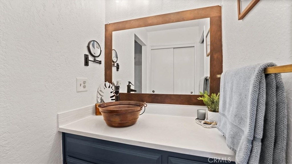 32 Mission Olive Road Oroville, CA 95966 - Photo 52 of 52 a bathroom with a sink and a mirror