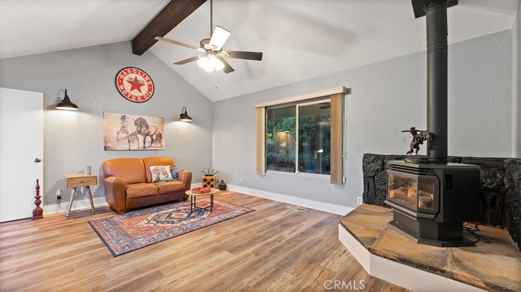 32 Mission Olive Road Oroville, CA 95966 - Photo 9 of 52 a living room with furniture and a fireplace