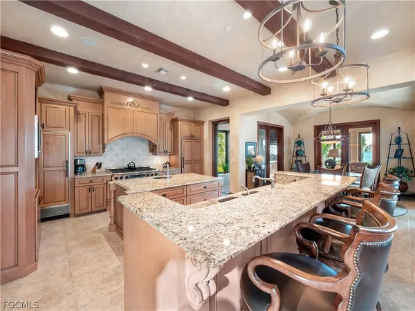 a large white kitchen with lots of counter top space