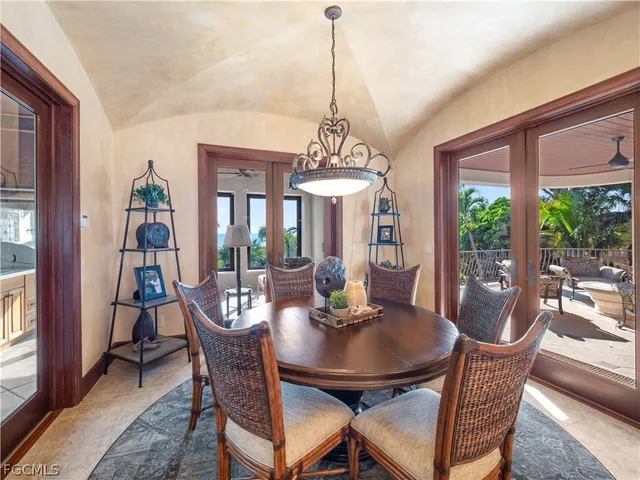 a balcony with furniture and a potted plant