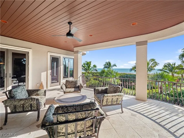 a view of a patio with a table and chairs