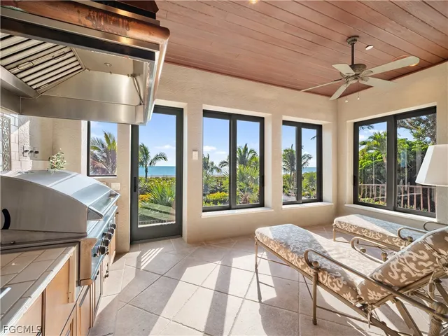 a kitchen with a stove top oven and cabinets