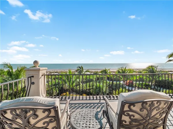 a view of a yard with an ocean view