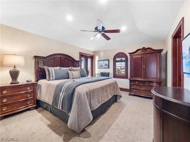 a bedroom with a bed and a table