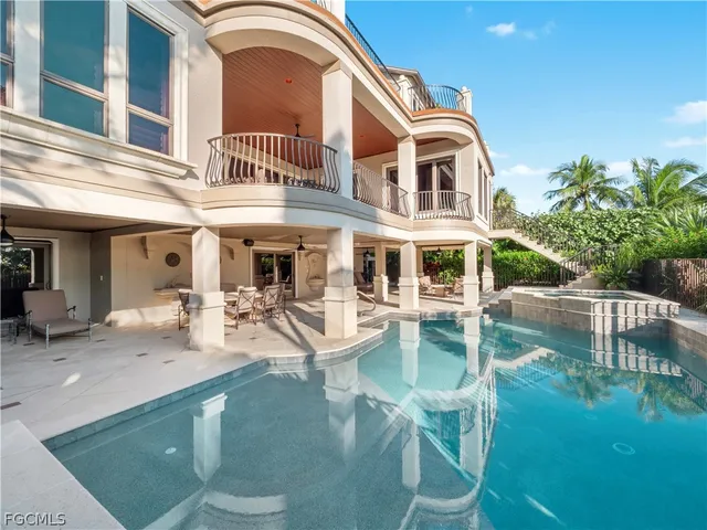 a view of a patio with a table chairs and backyard