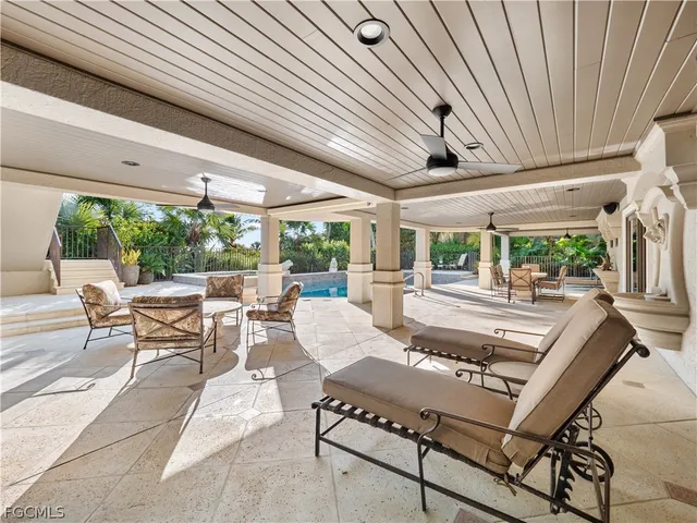 a view of a swimming pool with a patio