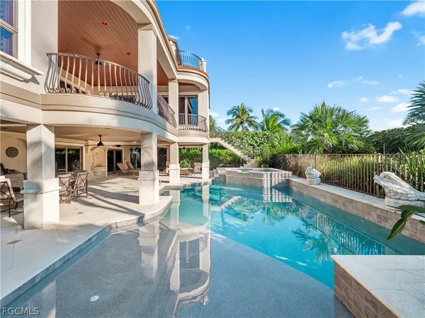 a view of a house with backyard porch and sitting area