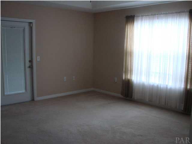 9115 Byrom Campbell Road Pace, FL 32571 - Photo 12 of 25 Master Bedroom w/Door to Sunroom
