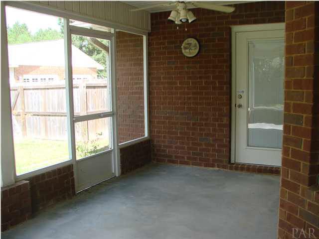 9115 Byrom Campbell Road Pace, FL 32571 - Photo 17 of 25 Sunroom w/Door to Master Bedroom