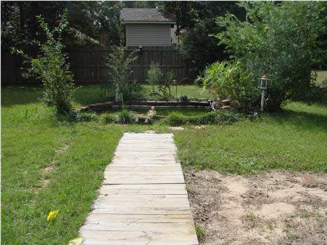 9115 Byrom Campbell Road Pace, FL 32571 - Photo 21 of 25 Sidewalk to Koi