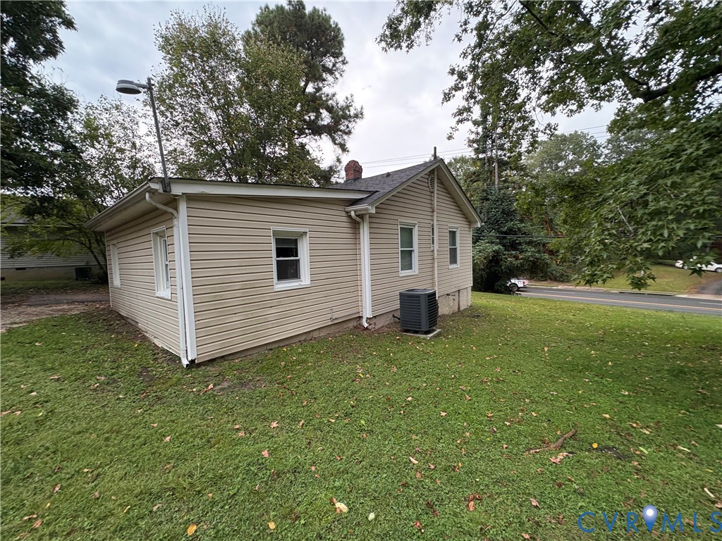 1904 Arlington Road Hopewell, VA 23860 - Photo 11 of 13 View of home's exterior featuring a yard and a cen