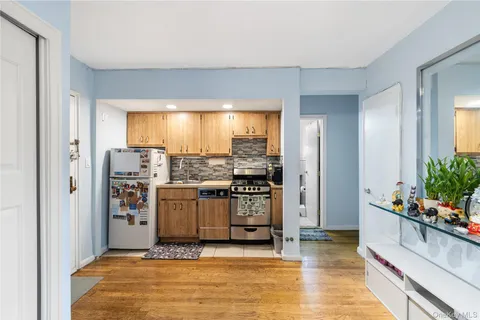 a view of a kitchen with a sink and cabinets