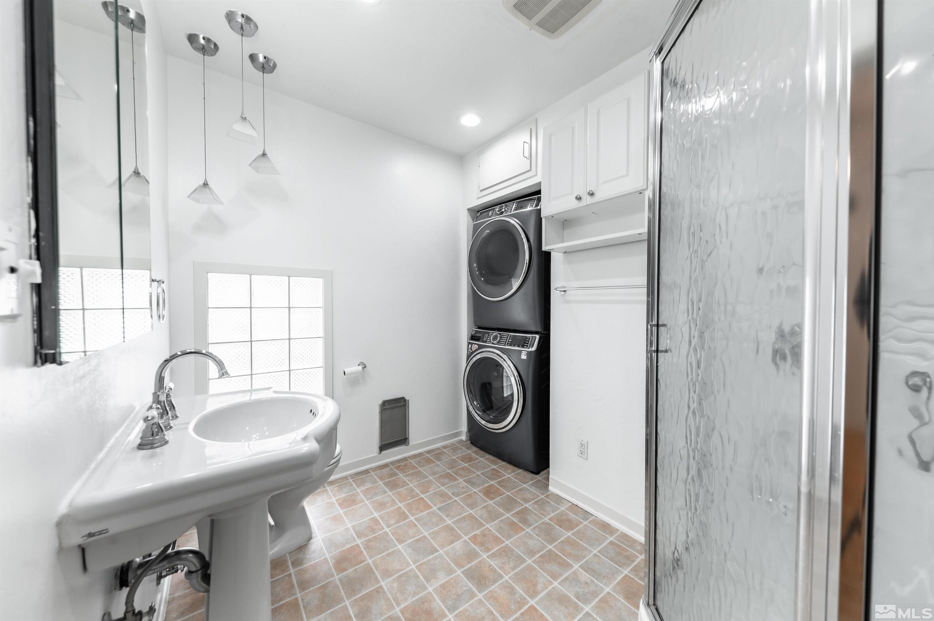 17 Linwood Place Reno, NV 89509 - Photo 25 of 36 a bathroom with a sink a toilet and a mirror