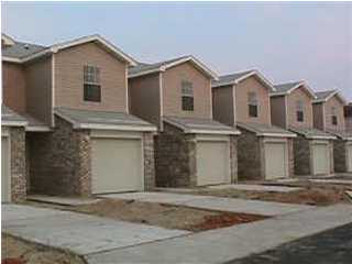 500 Keystone Road, Unit X Mary Esther, FL 32569 - Photo 1 of 1 a view of a white house with large windows next to a road