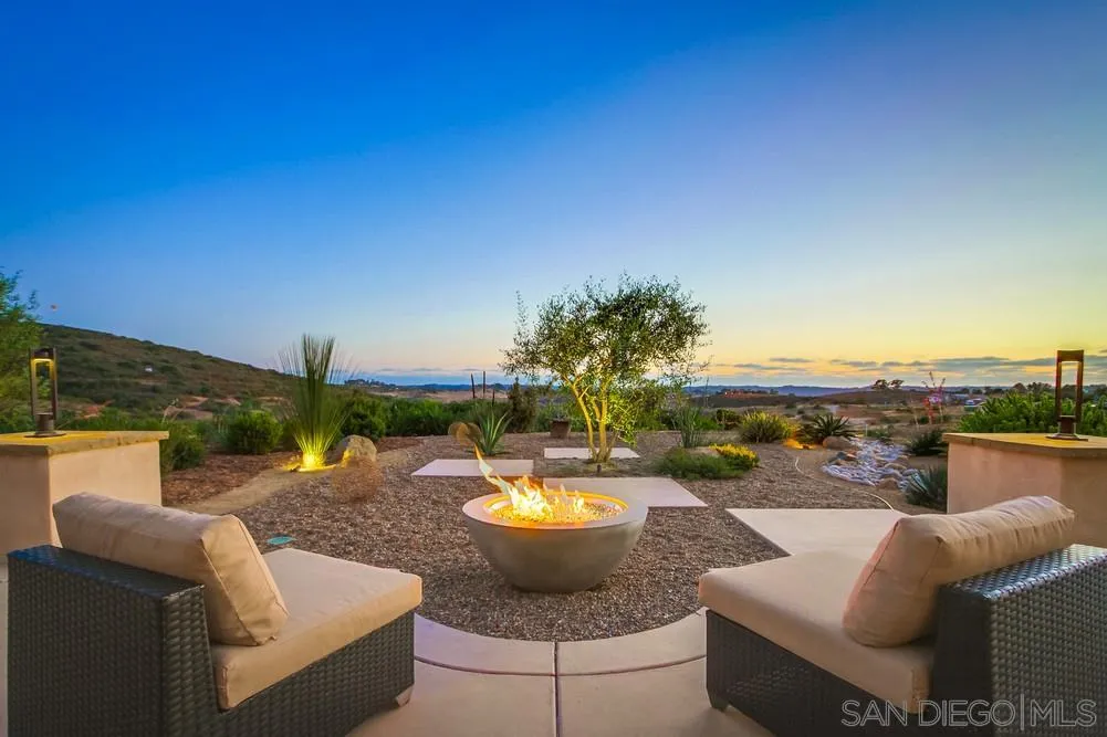 8248 Fortuna Santa Fe Road San Diego, CA 92127 - Photo 1 of 24 a view of a swimming pool with a couches in a patio